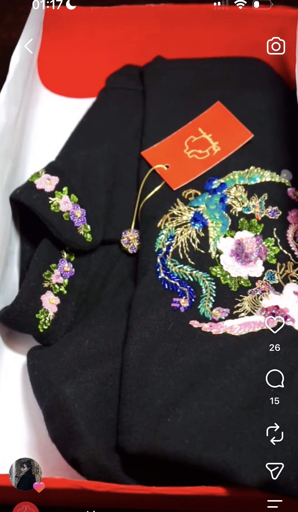 Detailed colourful embroidery and beadwork on black fabric