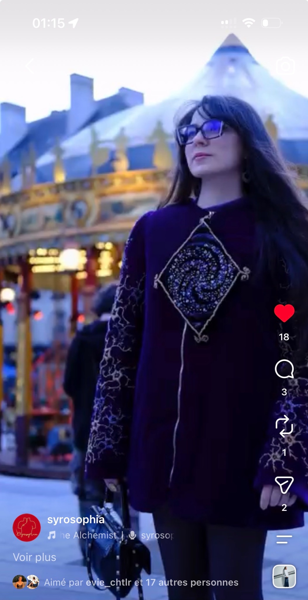 Dark coat with brightly coloured spiral embroidery